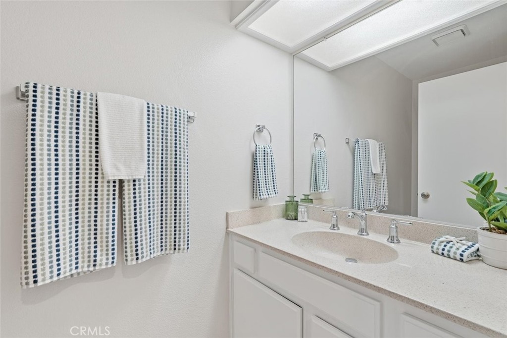 3101 Plaza Del Amo, Unit 8 Torrance, CA 90503 - Photo 13 of 31 a bathroom with a double vanity sink and a mirror