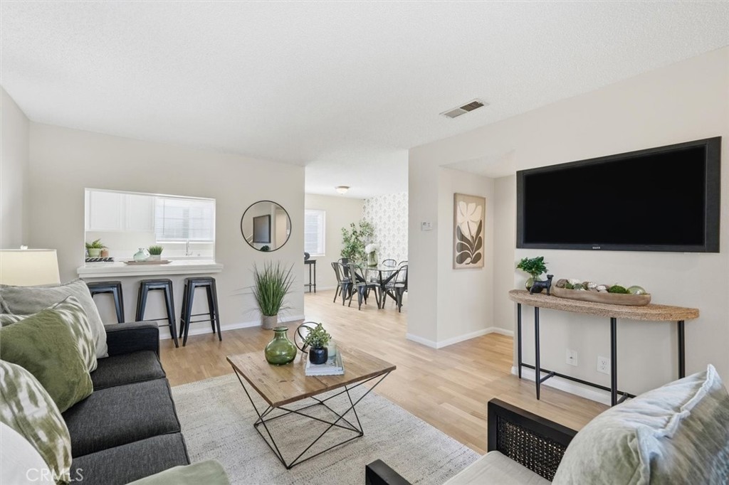 3101 Plaza Del Amo, Unit 8 Torrance, CA 90503 - Photo 2 of 31 a living room with furniture and a flat screen tv