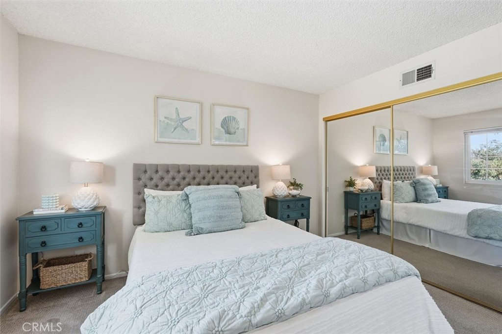 3101 Plaza Del Amo, Unit 8 Torrance, CA 90503 - Photo 21 of 31 a bedroom with a bed and a couch