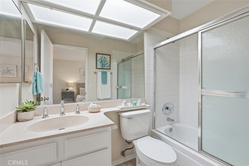 3101 Plaza Del Amo, Unit 8 Torrance, CA 90503 - Photo 22 of 31 a bathroom with a sink toilet a mirror and shower