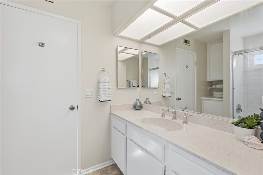 3101 Plaza Del Amo, Unit 8 Torrance, CA 90503 - Photo 23 of 31 a bathroom with a sink and a mirror
