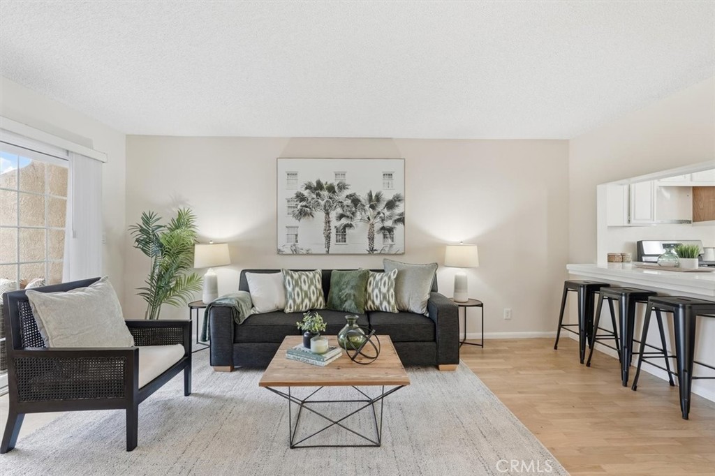 3101 Plaza Del Amo, Unit 8 Torrance, CA 90503 - Photo 3 of 31 a living room with furniture and a potted plant