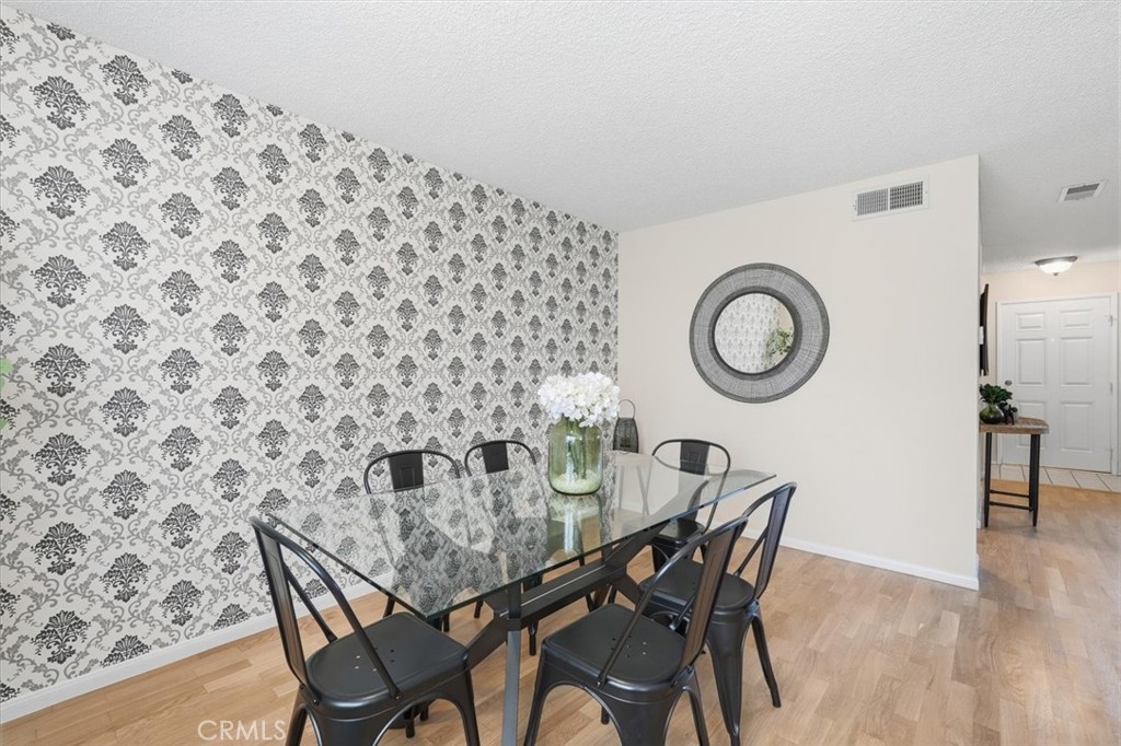 3101 Plaza Del Amo, Unit 8 Torrance, CA 90503 - Photo 9 of 31 a view of a dining room with furniture and a mirror