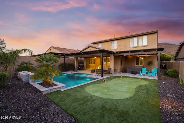 a view of a swimming pool with a patio