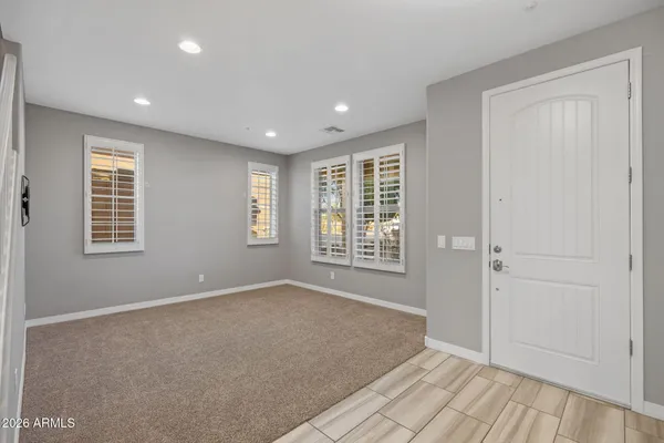 a view of an empty room with stairs
