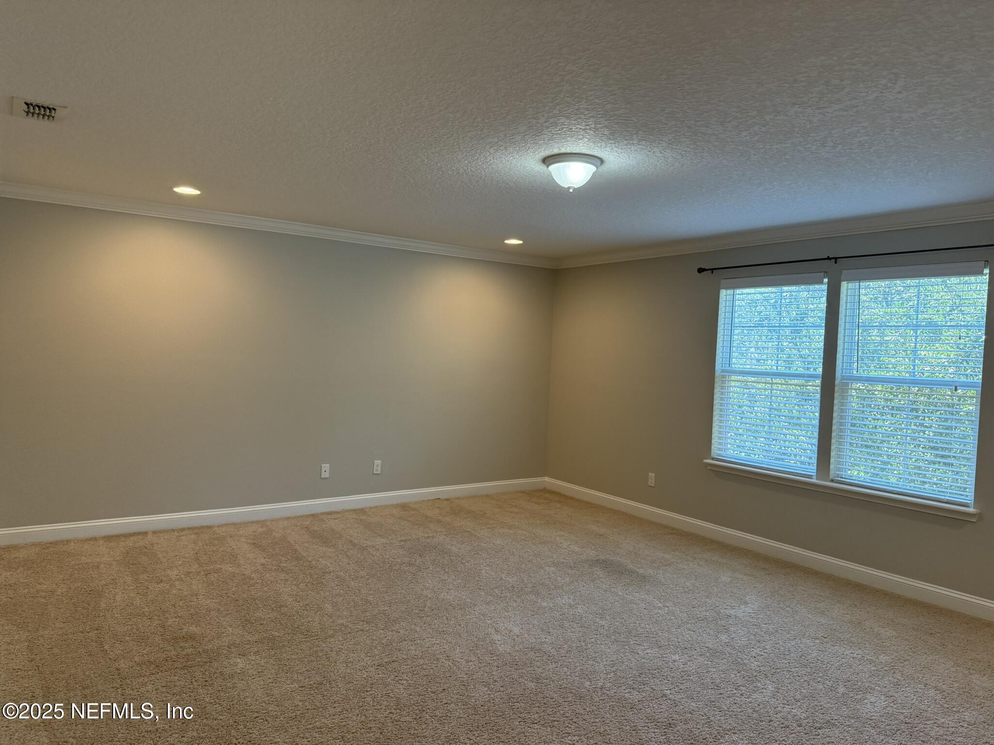 12198 Ridge Crossing Way Jacksonville, FL 32226 - Photo 21 of 28 a view of an empty room with a window