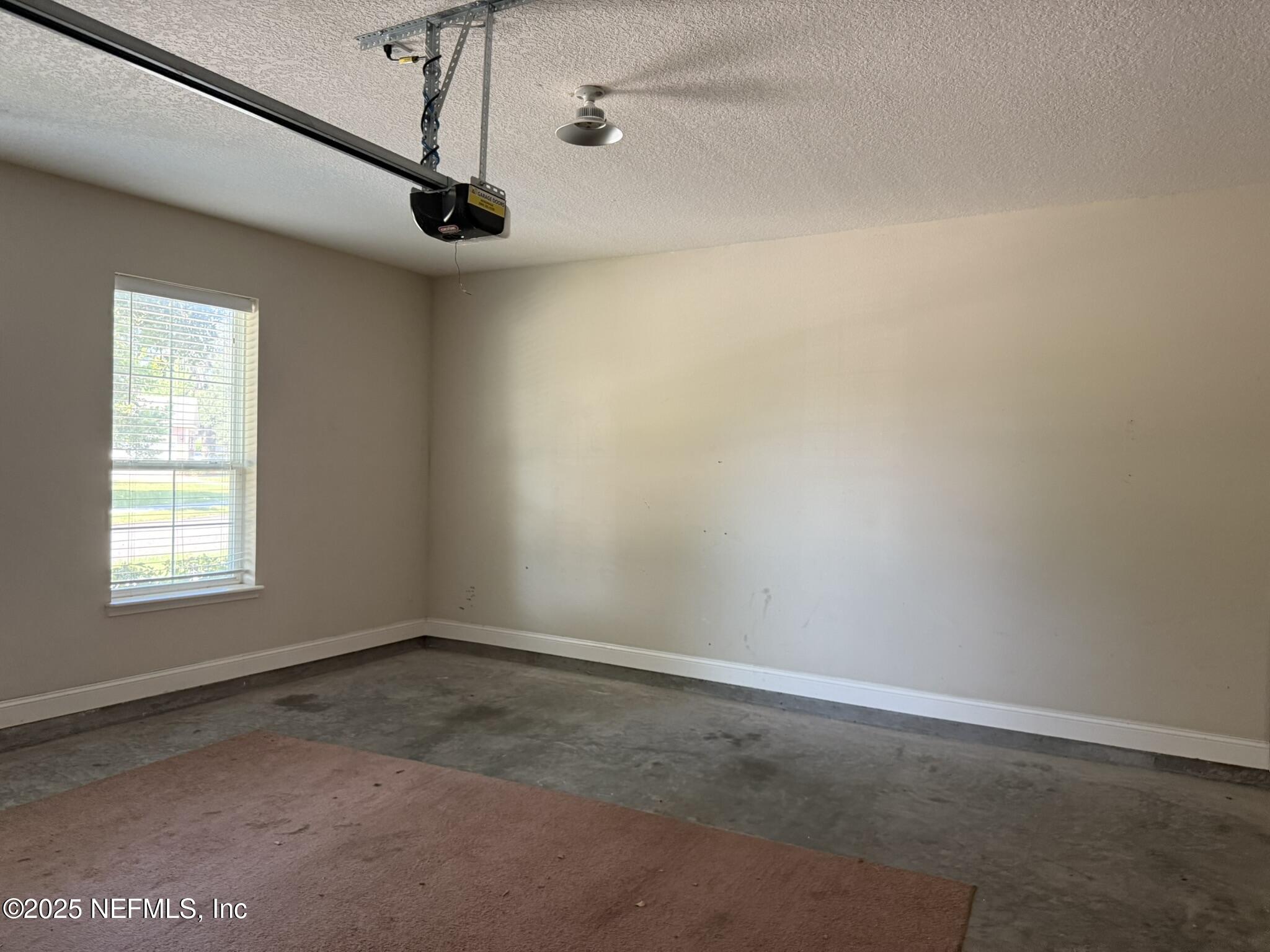 12198 Ridge Crossing Way Jacksonville, FL 32226 - Photo 22 of 28 a view of a room with a window and a ceiling fan