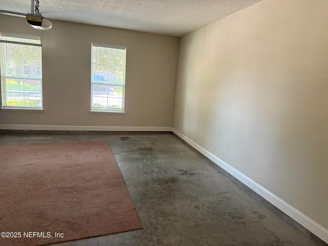 a view of a backyard with large trees