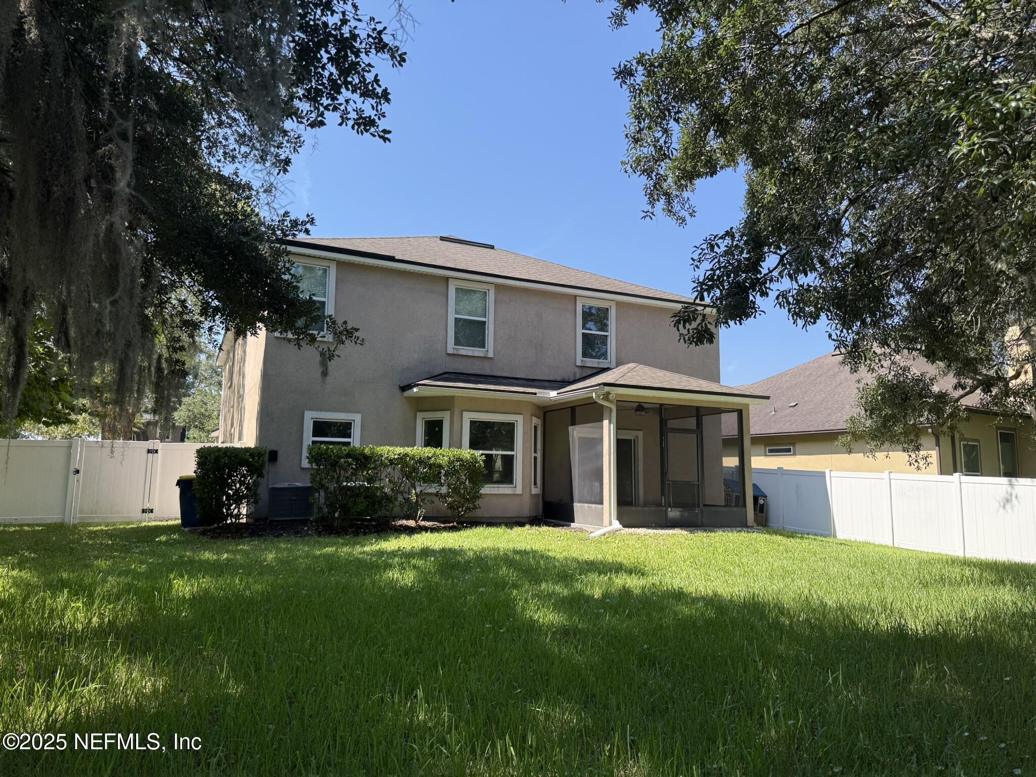 12198 Ridge Crossing Way Jacksonville, FL 32226 - Photo 28 of 28 a front view of a house with a garden and trees