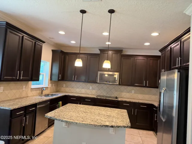 a kitchen with granite countertop cabinets and a sink