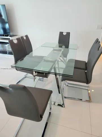 a bed sitting in a bedroom and table