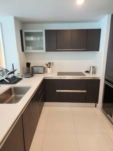 a kitchen with a sink and cabinets
