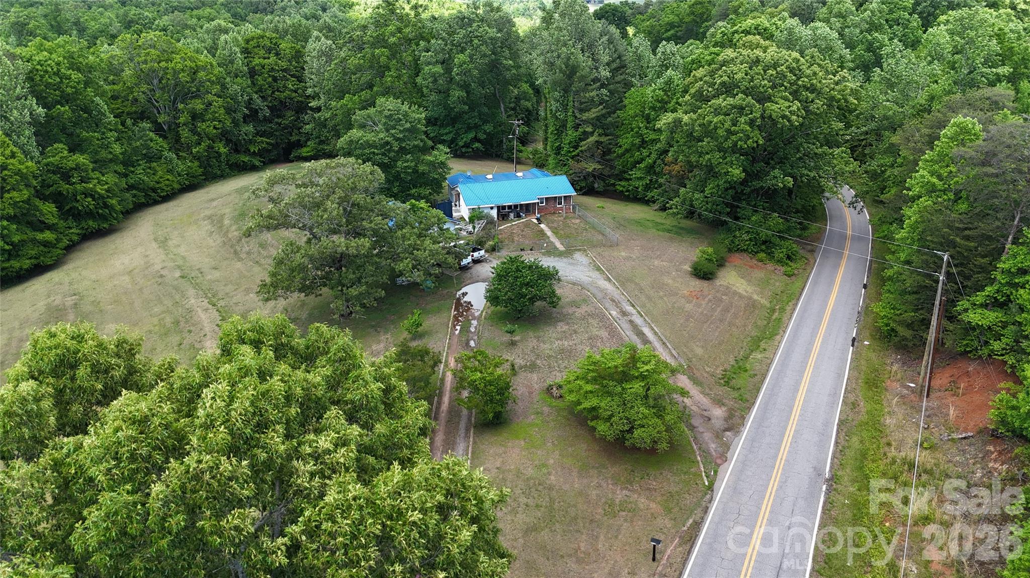 781 Rock Road Rutherfordton, NC 28139 - Photo 18 of 28 a view of a garden with plants and a bench