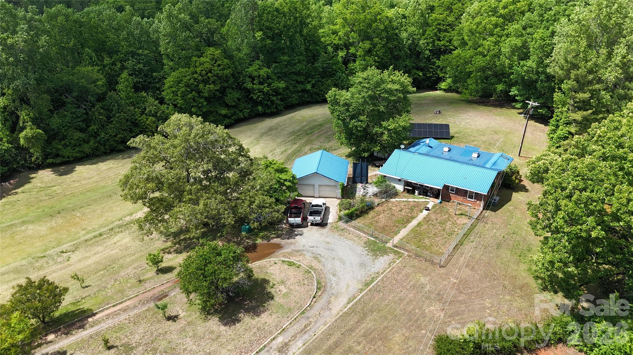 781 Rock Road Rutherfordton, NC 28139 - Photo 2 of 28 an aerial view of a house with a yard and trees