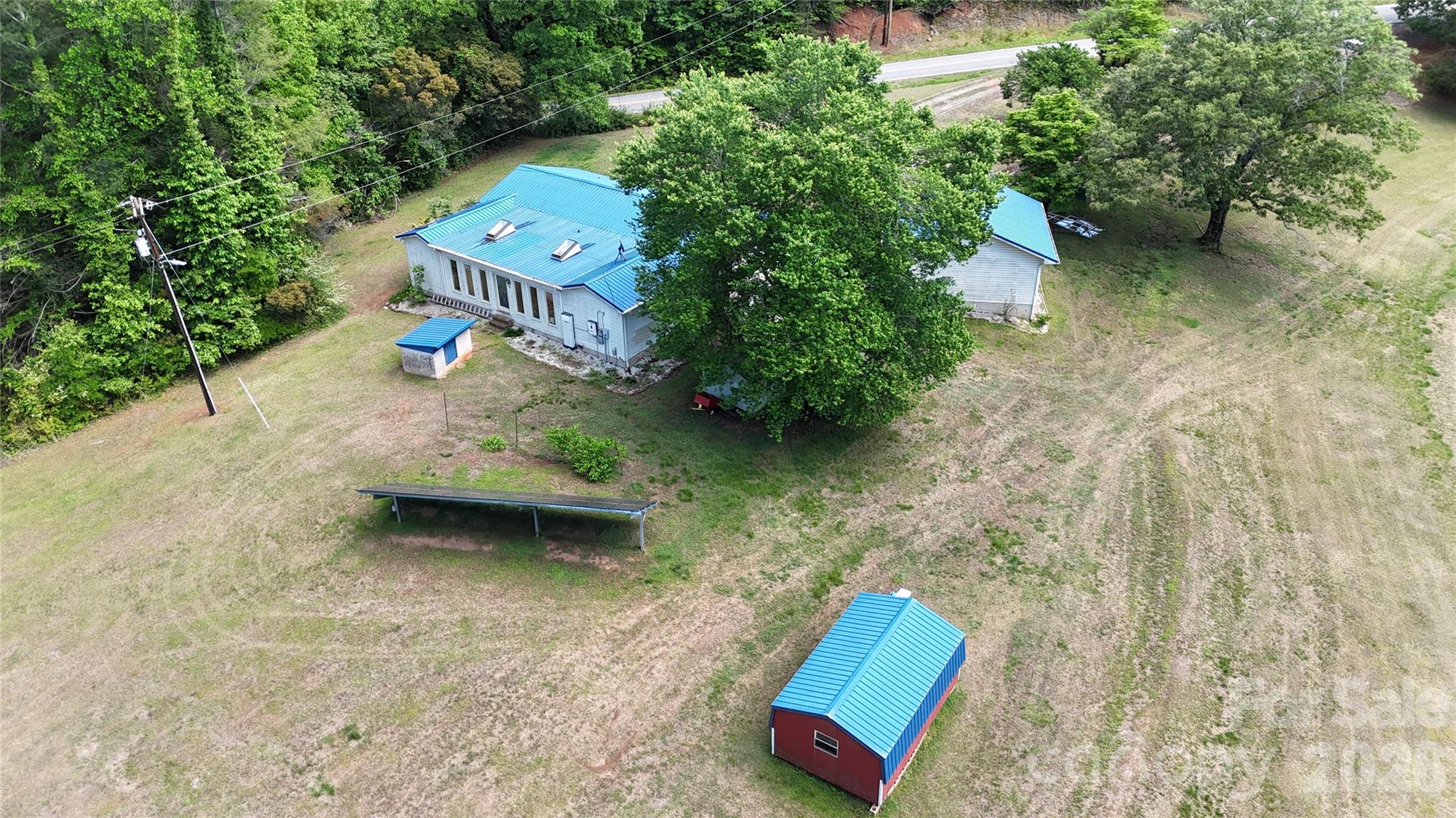781 Rock Road Rutherfordton, NC 28139 - Photo 24 of 28 an aerial view of a house with outdoor space and lake view