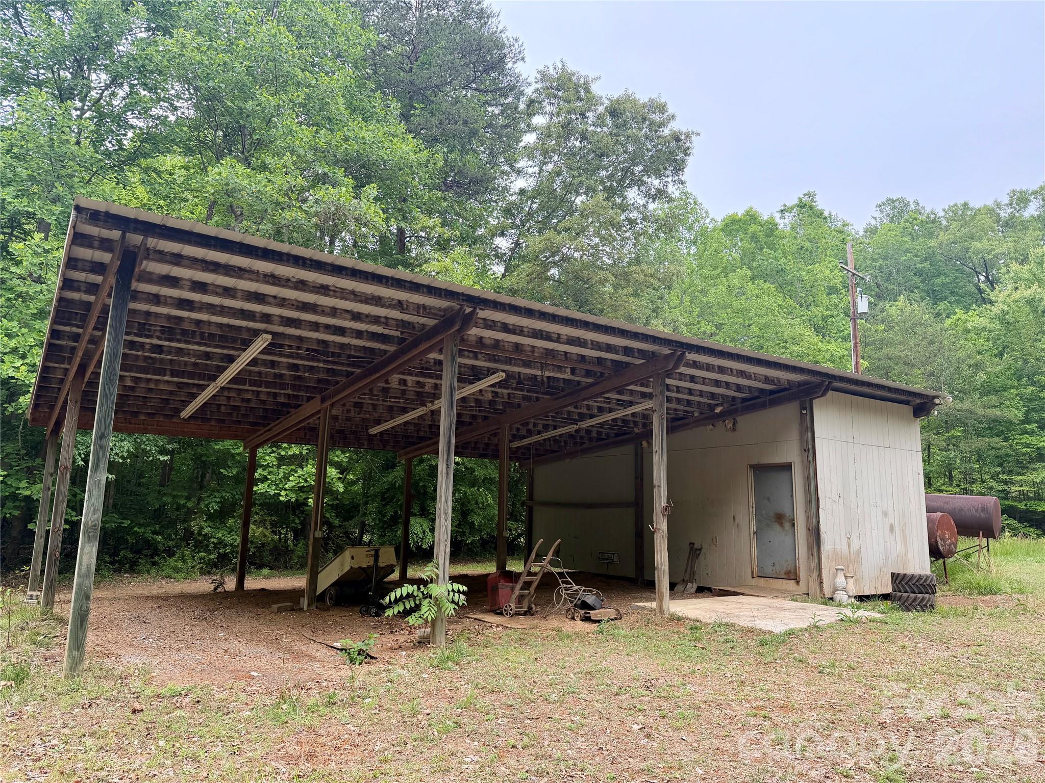 781 Rock Road Rutherfordton, NC 28139 - Photo 28 of 28 a view of a wooden deck with a patio
