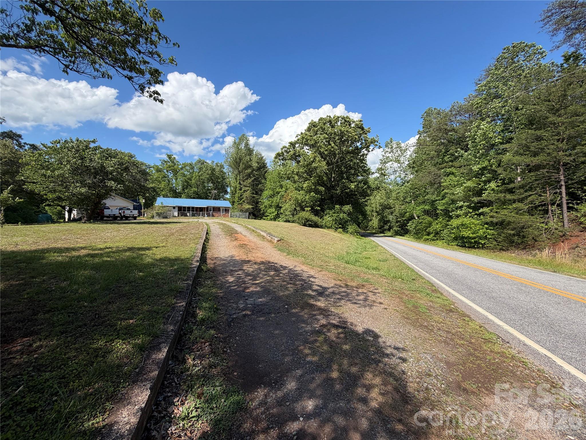 781 Rock Road Rutherfordton, NC 28139 - Photo 3 of 28 a view of a yard with plants and a trees
