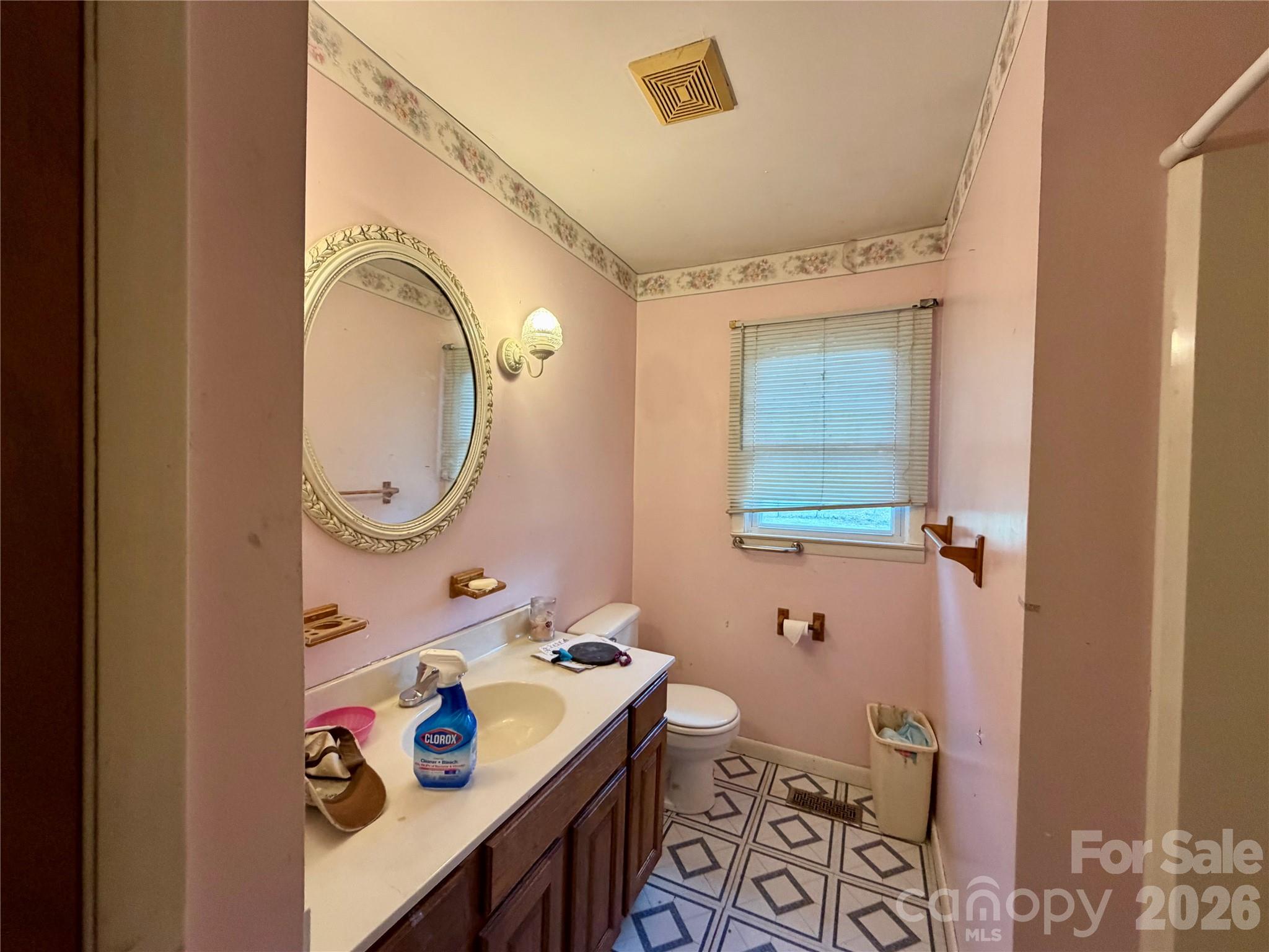 781 Rock Road Rutherfordton, NC 28139 - Photo 10 of 28 a bathroom with a sink mirror vanity and toilet