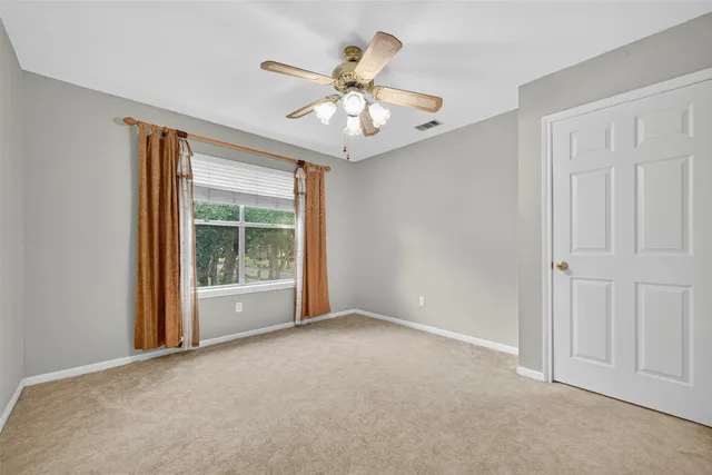 a view of a hallway with a window