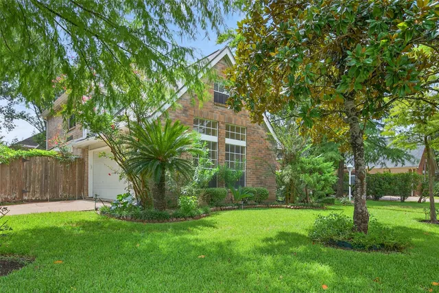 a view of outdoor space with garden and trees