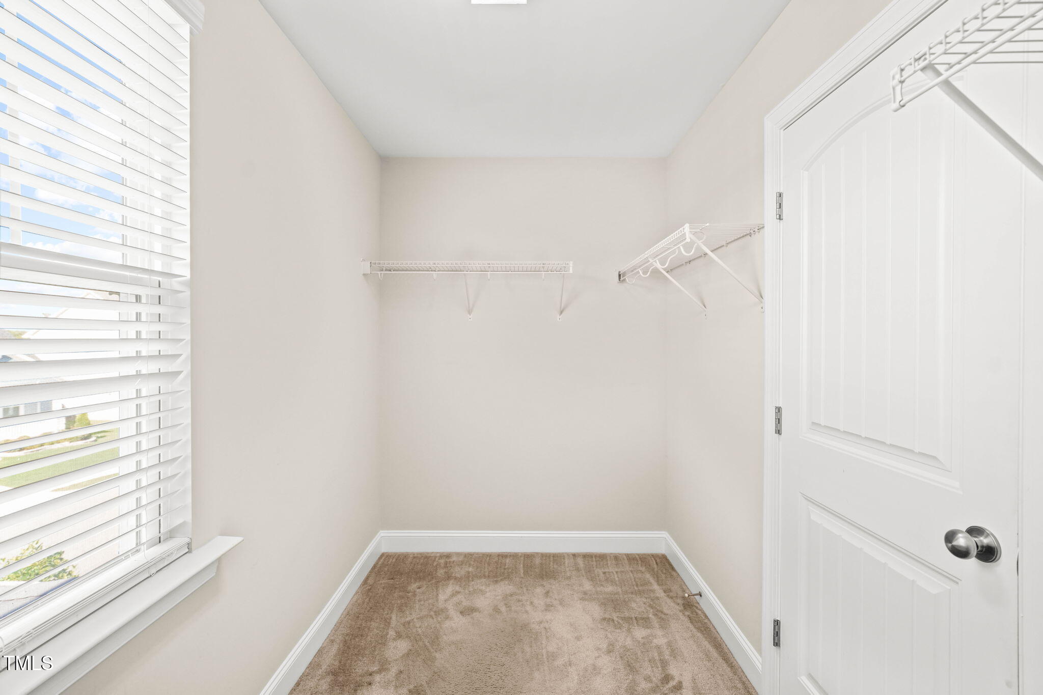 4508 Brintons Cottage Street Raleigh, NC 27616 - Photo 26 of 46 a view of small space with racks on the wall and a window