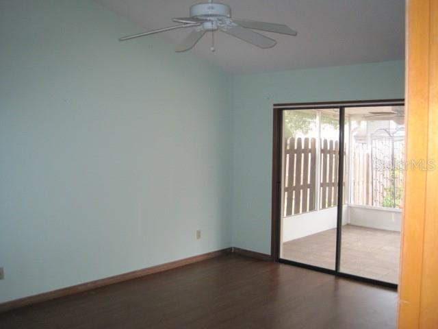 5415 Rutland Court Orlando, FL 32812 - Photo 12 of 25 wooden floor in an empty room with a window