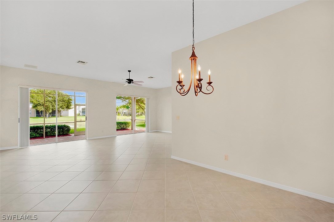 9139 Springview Loop Estero, FL 33928 - Photo 8 of 25 a view of an empty room with window and cabinet