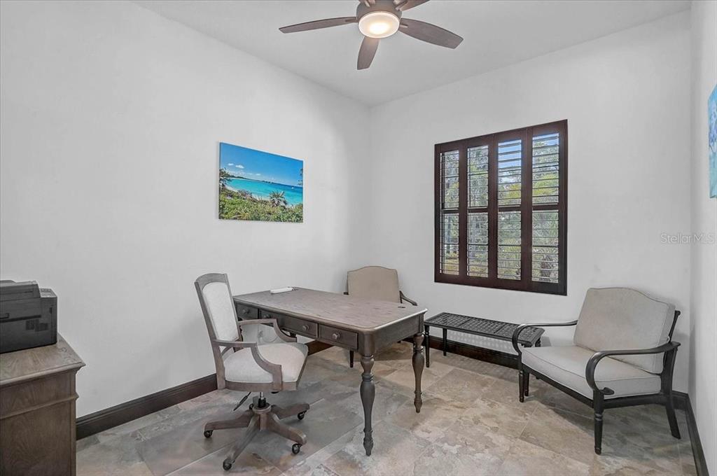 113 Burney Road Osprey, FL 34229 - Photo 17 of 42 a workspace with furniture and a window