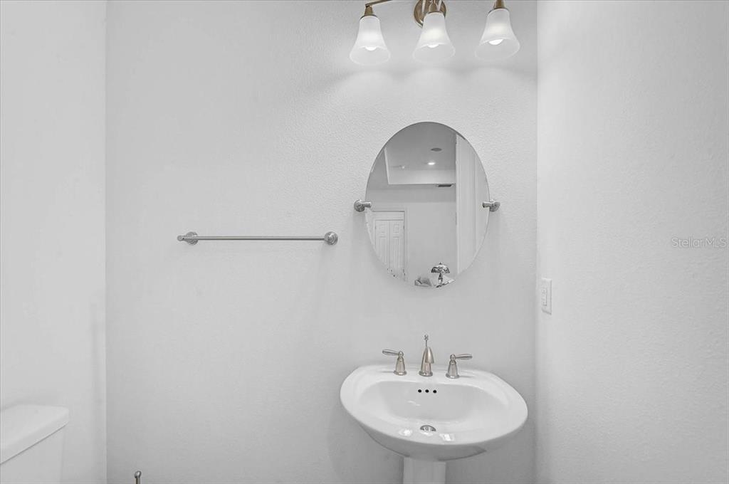 113 Burney Road Osprey, FL 34229 - Photo 18 of 42 a bathroom with a sink and a mirror