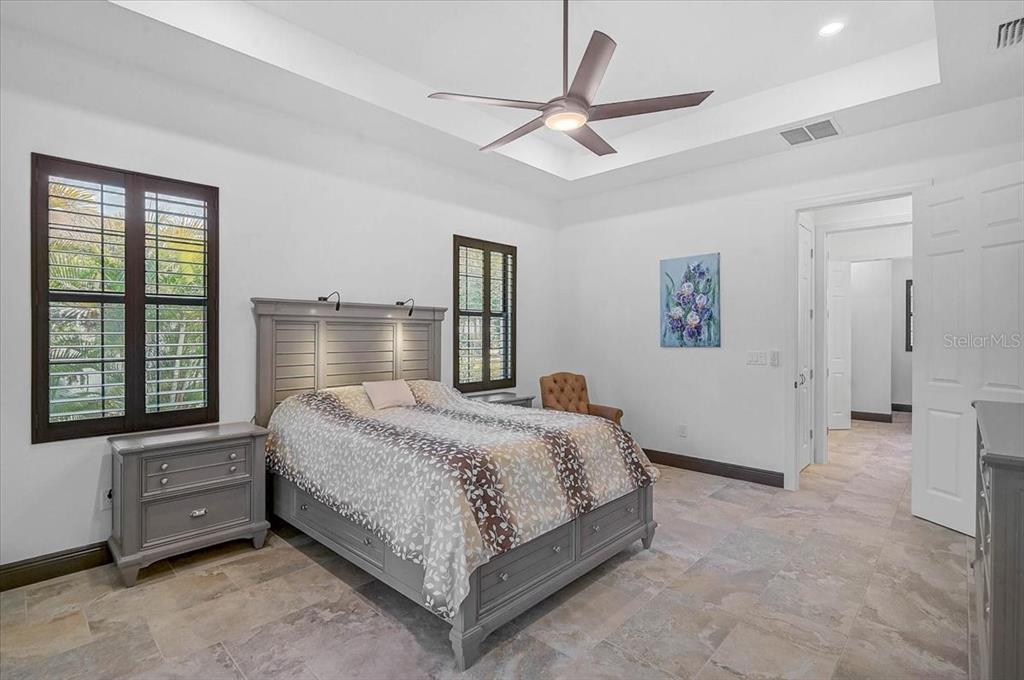 113 Burney Road Osprey, FL 34229 - Photo 20 of 42 a bedroom with a bed and a large window
