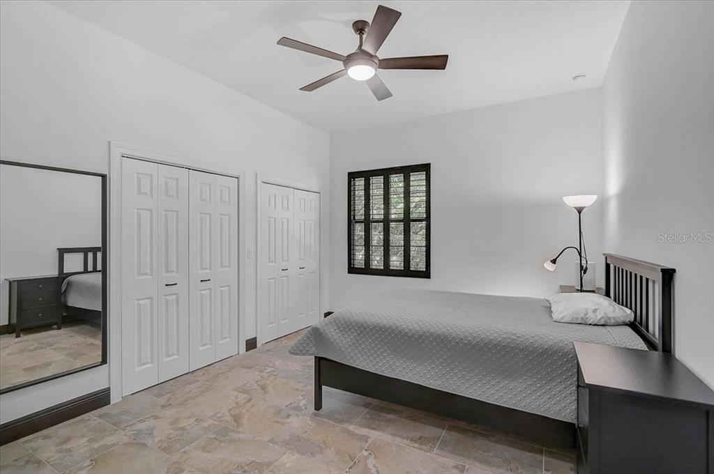 113 Burney Road Osprey, FL 34229 - Photo 24 of 42 a bedroom with a bed and a window