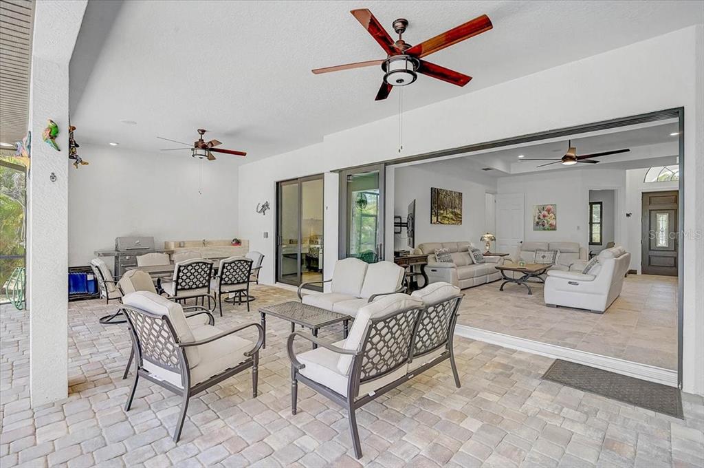 113 Burney Road Osprey, FL 34229 - Photo 30 of 42 a living room with furniture and a ceiling fan