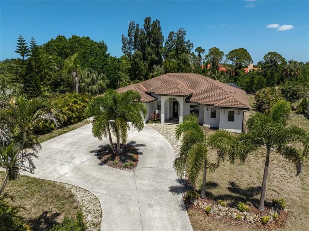113 Burney Road Osprey, FL 34229 - Photo 3 of 42 a view of a house with a yard
