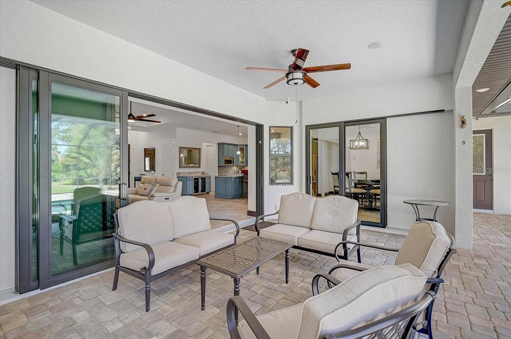 113 Burney Road Osprey, FL 34229 - Photo 31 of 42 a living room with furniture and a large window