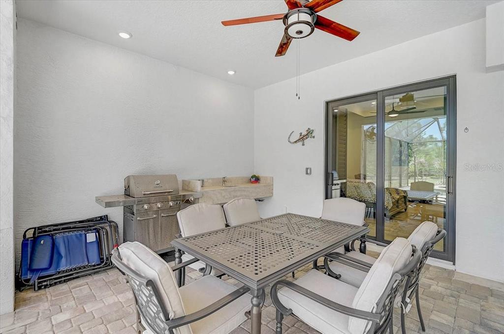 113 Burney Road Osprey, FL 34229 - Photo 32 of 42 a living room with furniture and wooden floor