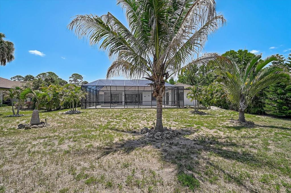 113 Burney Road Osprey, FL 34229 - Photo 35 of 42 a front view of a house with a yard