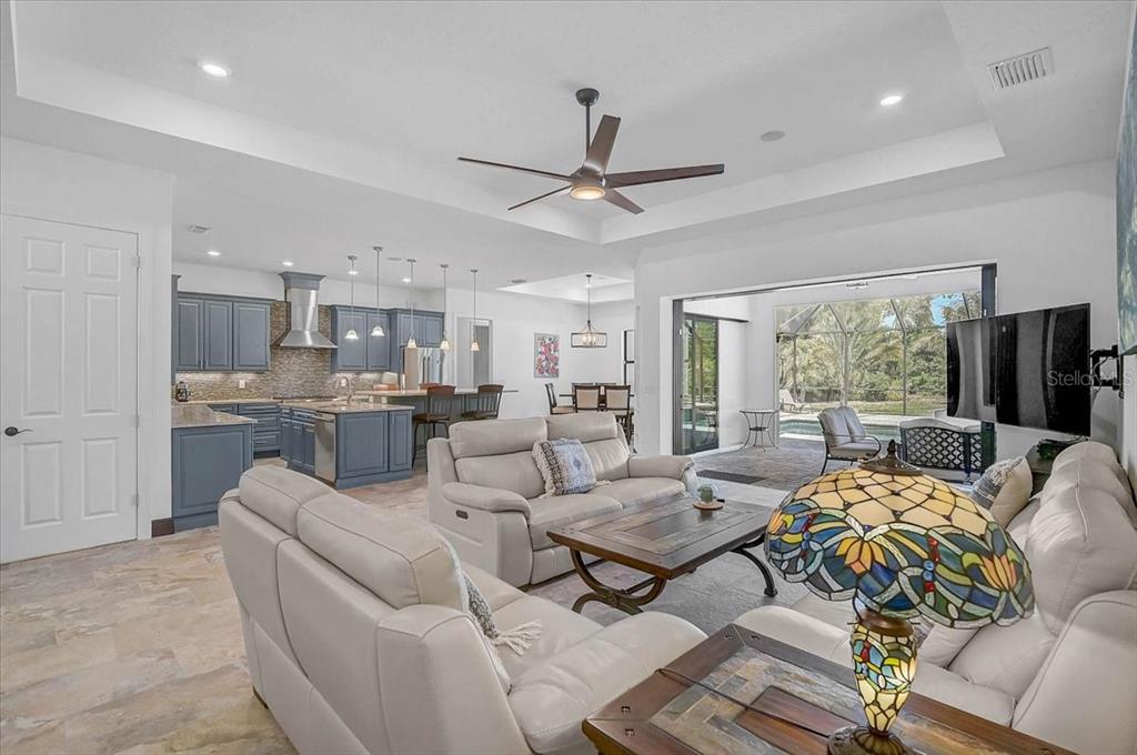 113 Burney Road Osprey, FL 34229 - Photo 7 of 42 a living room with furniture and a large window
