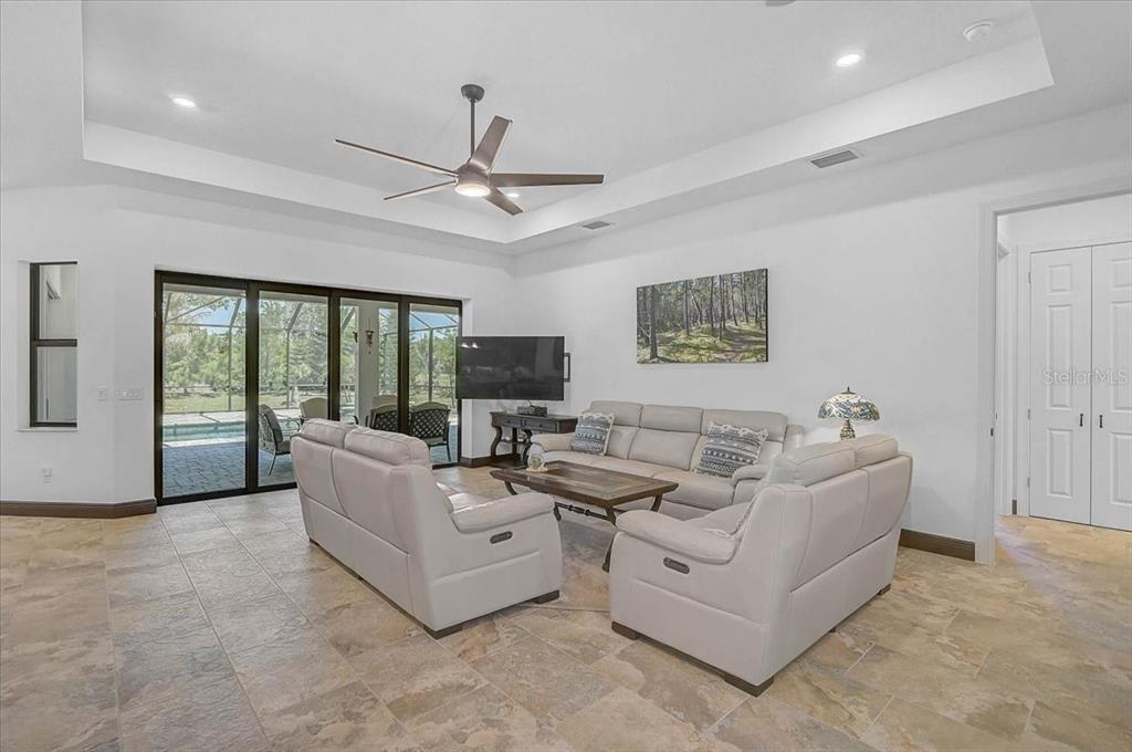113 Burney Road Osprey, FL 34229 - Photo 8 of 42 a living room with furniture and a large window