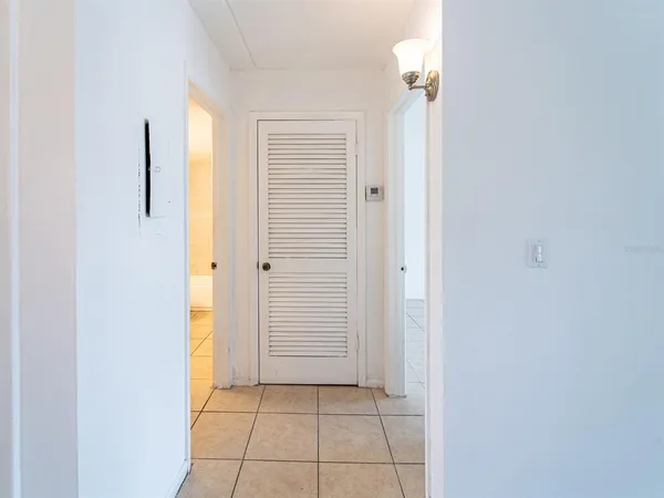 a view of a hallway with a bathroom