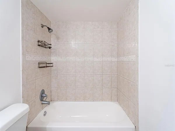 a bathroom with a bath tub