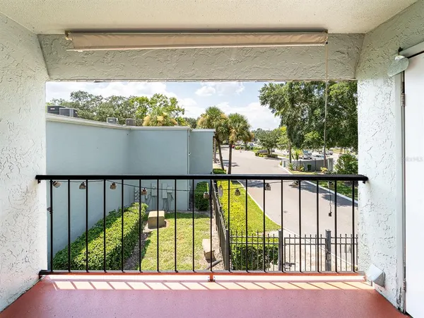 a view of a balcony with an outdoor space