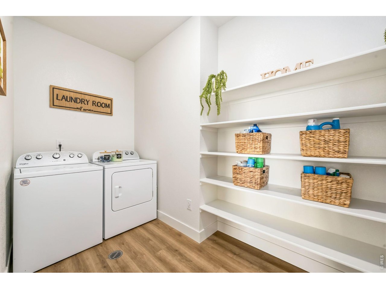 761 Muturu Road Johnstown, CO 80534 - Photo 17 of 35 A roomy laundry area offers built-in storage and an included washer and dryer.