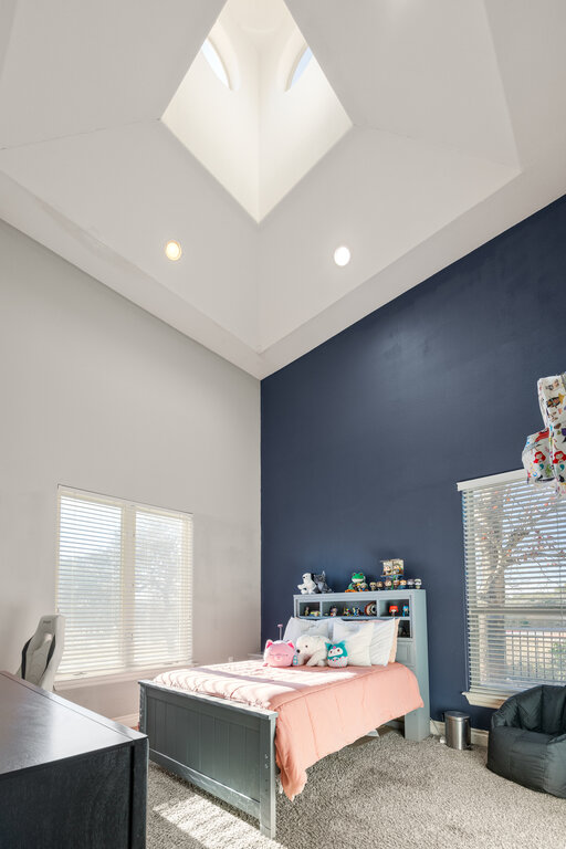 22226 Rivolta Lane San Antonio, TX 78257 - Photo 13 of 24 a room with a bed and a window