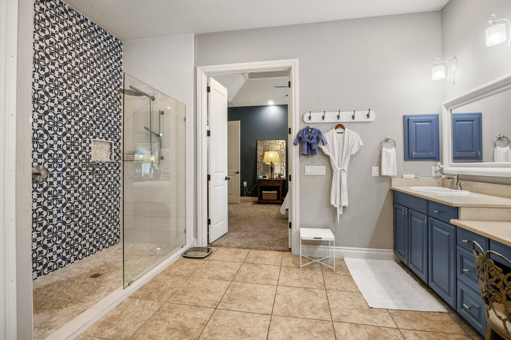 22226 Rivolta Lane San Antonio, TX 78257 - Photo 17 of 24 a bathroom with a sink a toilet and shower