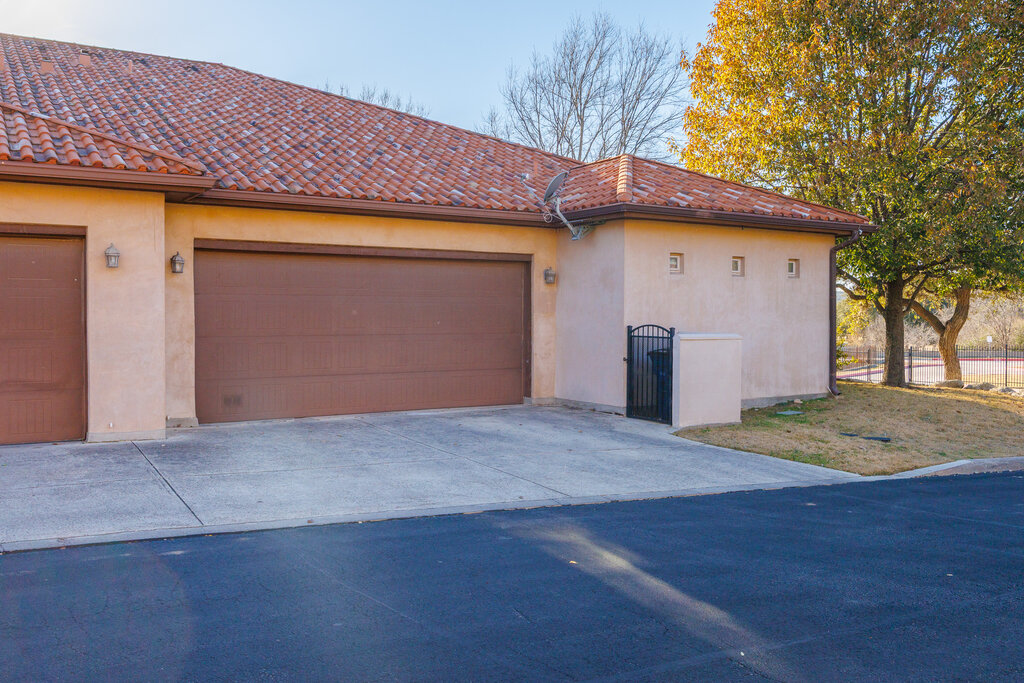 22226 Rivolta Lane San Antonio, TX 78257 - Photo 24 of 24 a front view of a house with a yard and garage