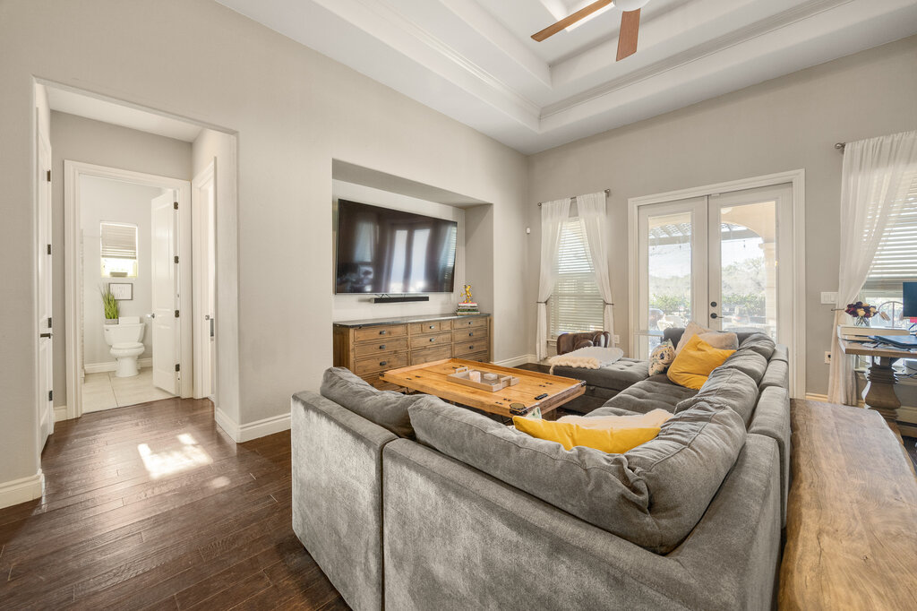 22226 Rivolta Lane San Antonio, TX 78257 - Photo 8 of 24 a living room with furniture and a flat screen tv