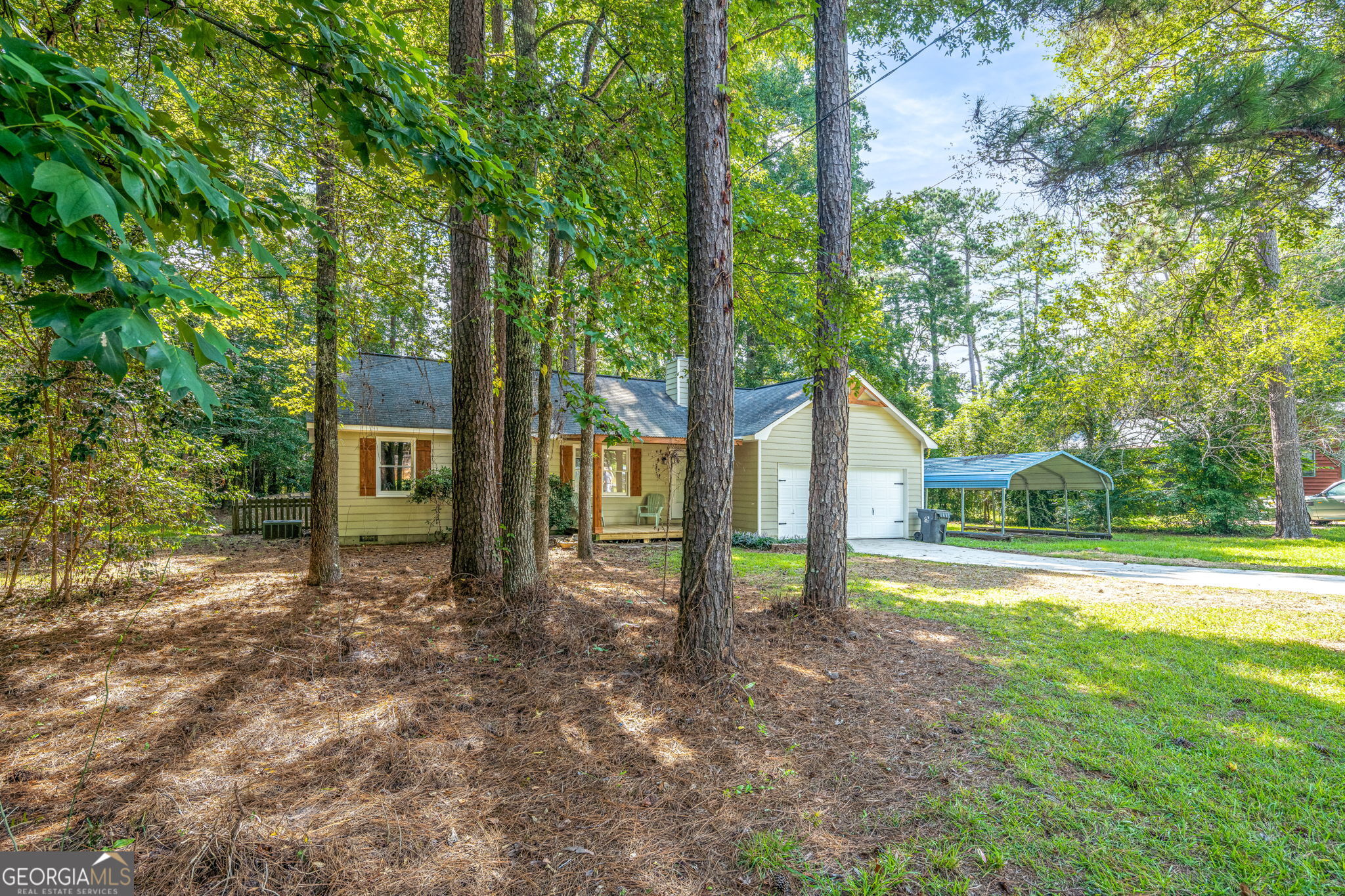 1029 Santa Fe Trail Macon, GA 31220 - Photo 1 of 1 a view of a house with backyard and trees