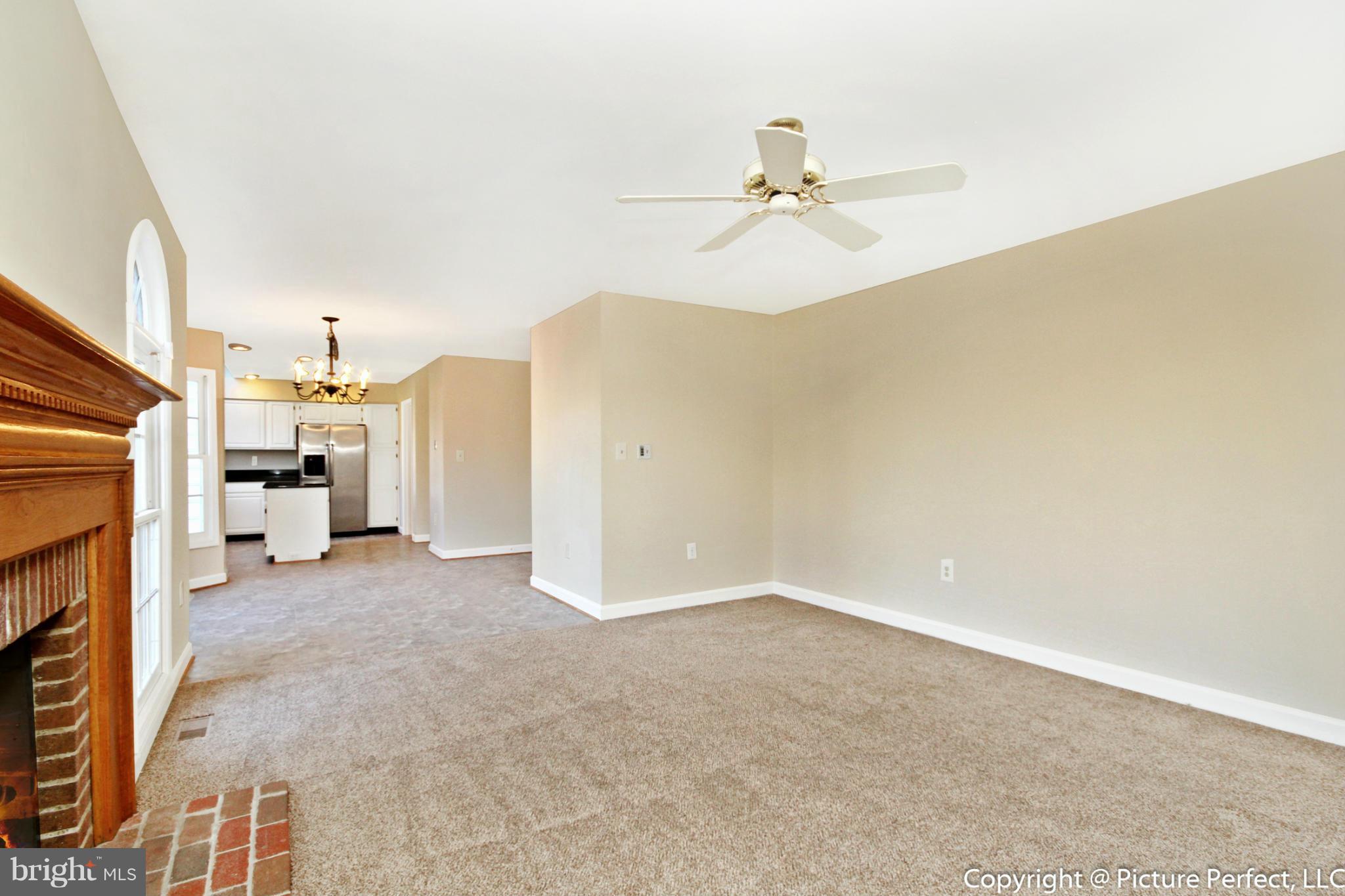 19111 Munger Farm Road Poolesville, MD 20837 - Photo 13 of 30 a view of a livingroom with a fireplace