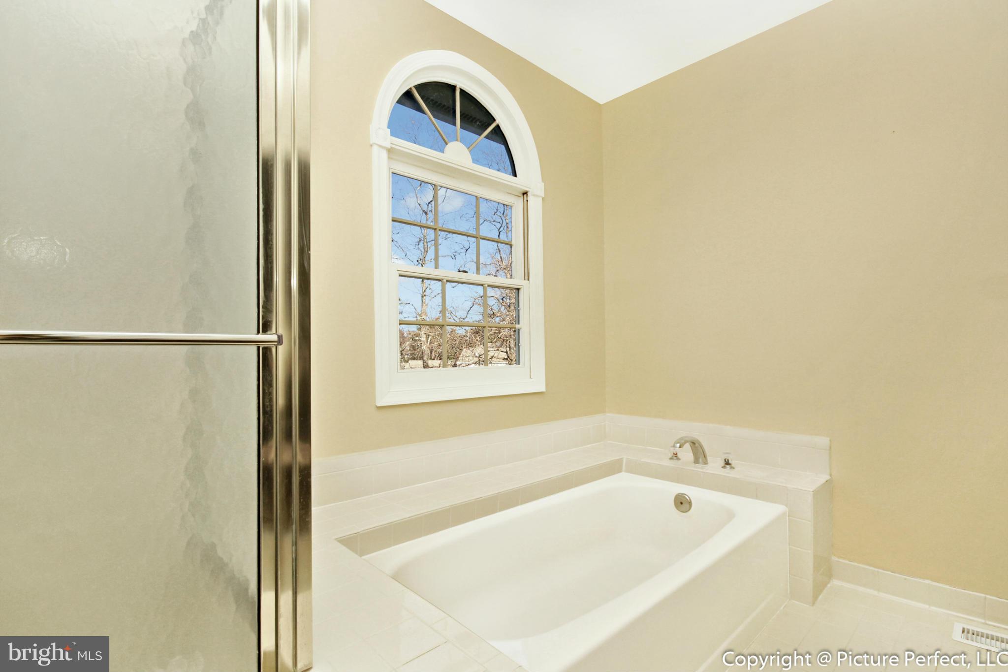 19111 Munger Farm Road Poolesville, MD 20837 - Photo 22 of 30 a bath tub sitting next to a window