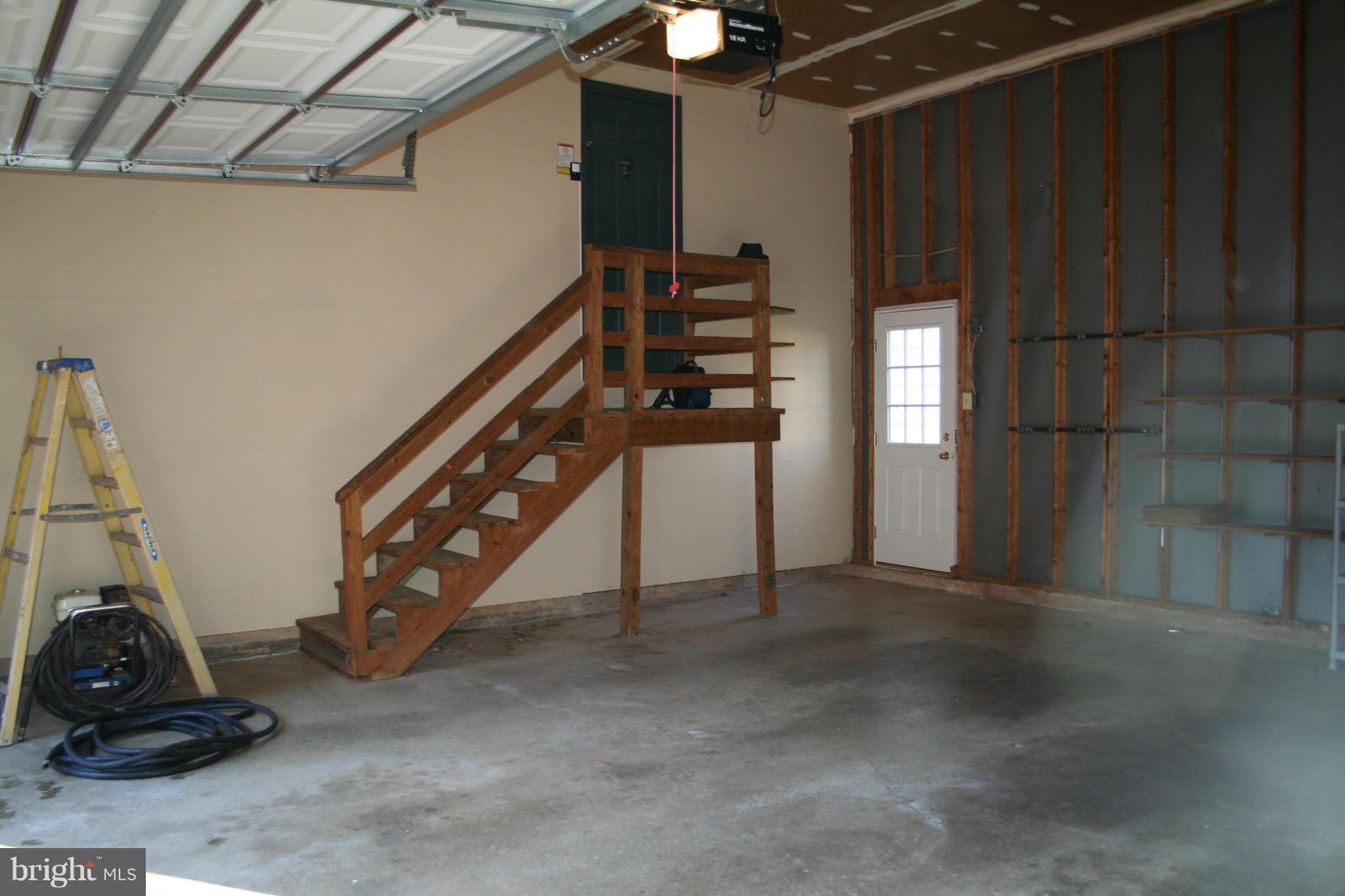 19111 Munger Farm Road Poolesville, MD 20837 - Photo 29 of 30 a view of an empty room with stairs and a couch